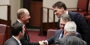 Fraser Anning is congratulated by Cory Bernardi after delivering his first speech in the Senate.