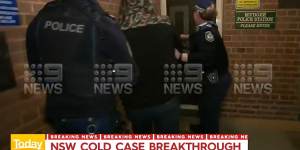 Mr Rumsby being escorted into Mudgee police station on Tuesday night.