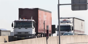Trucks coming down M5 East ramp,heading for Port Botany. The government remains without a concrete plan to connect WestConnex to Sydney Airport or Port Botany.