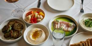 Assorted meze including zucchini kefte and tzatziki.