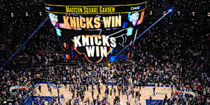 Players and fans celebrate after the New York Knicks’ game four win over San Antonio.