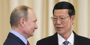 Chinese Vice-Premier Zhang Gaoli,right,is welcomed by Russian President Vladimir Putin in 2017.