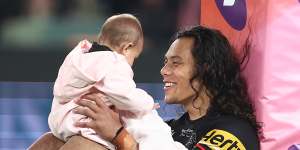 Jarome Luai with daughter Akira after clinching a place in the 2022 grand final.