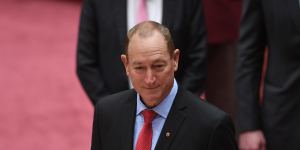 Senator Fraser Anning reads the oath of office as he is sworn in on Monday.
