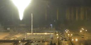 This image from a video released by the Zaporizhzhia nuclear power plant in Ukraine shows a bright flaring object landing in the grounds of the complex in March 2022.