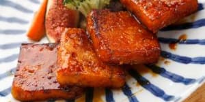 Pumpkin mochi cakes with sake and soy dressing.