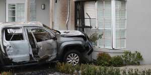 Luxury car swindler targeted as burning cars slam into suburban home