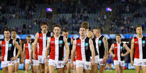 The Saints leave the field after their 111-point loss.