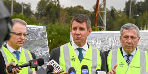 NSW Premier Mike Baird,centre,Roads Minister Duncan Gay,right,and Federal Minister for Urban Infrastructure Paul Fletcher at the Rozelle Rail Yards. 