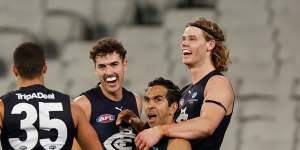 Players celebrate Eddie Betts’ final term goal. 