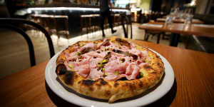 Mortadella pizza with taleggio and pistachio.