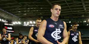 A shattered Ed Curnow leaves the field after his 200th match.