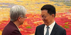 Foreign Minister Penny Wong shaking hands with Vice President Han Zheng in Beijing.