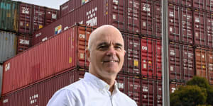 Andrew Coldrey,vice-president for the Asia Pacific region of global logistics firm CH Robinson,in front of stacks of empty shipping containers at the port.