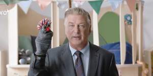 Hollywood actor Alec Baldwin,with his sock puppet,in the eToro ad