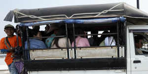 Myanmar residents cross the 1st Thai-Myanmar Friendship Bridge into Thailand on Friday.