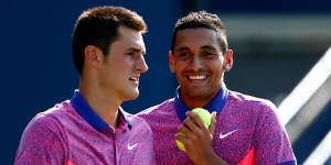 Bernard Tomic and Nick Kyrgios playing doubles at the 2014 US Open during a happier time.