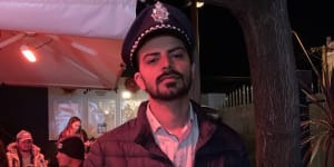 Waqar Hassan Virk,wearing a costume police hat,is accused of brandishing a Glock-lookalike water pistol outside NSW Parliament on Thursday afternoon.