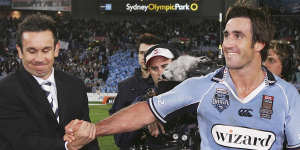Commentator Matthew Johns (left) with his brother Andrew,at the end of a State of Origin match.