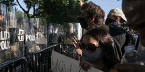 Protesters yell at military police during a demonstration in Washington,DC. 