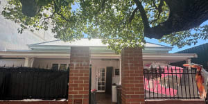 The Northbridge home is now draped with plastic,fabric and tarpaulins.