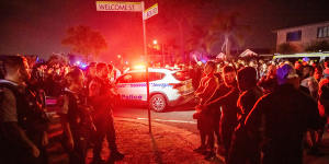 An angry crowd confronted police after the stabbing of Bishop Emmanuel.