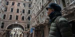 A resident looks at his apartment block destroyed in a Russian air raid in Kharkiv,Ukraine.