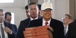 Republican presidential candidate former President Donald Trump arrives to deliver pizza to fire fighters