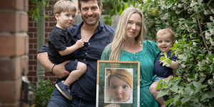 Rachael and Jonathan Casella with their boys Izaac (two) and Joshua (10 months),and a photo of their daughter Mackenzie who was born with spinal muscular atrophy and died just seven months later.