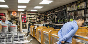A customer browses the guns on display at SP firearms in Hempstead,New York,on the day of the Supreme Court ruling.