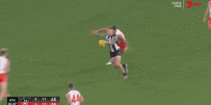 Brody Mihocek kicks a stunner for the Magpies late in their win.