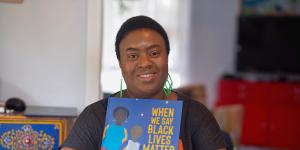 Clarke with her illustrated children’s book,When We Say Black Lives Matter.