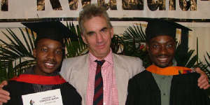Roebuck with students he helped through university.