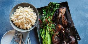 Twice-cook duck with charred Asian greens.