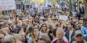 Protesters in Melbourne’s CBD rally on Sunday against gender-based violence,