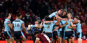 NSW players celebrate their series win at Suncorp in 2021.