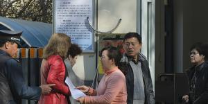 ID cards are checked and facial recognition used when entering almost all public spaces in Urumqi,the capital city of Xinjiang.
