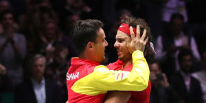 Roberto Bautista Agut and Rafael Nadal celebrate Spain's Davis Cup win.