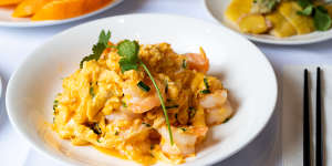Light and fluffy prawn scrambled eggs is studded with almost translucent steamed prawns.