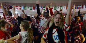 Croatian fans at the King Toms Club in Edensor Park celebrate Croatia's equaliser.