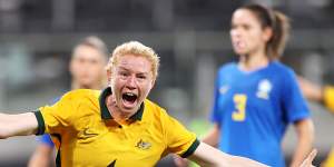 Clare Polkinghorne celebrates scoring a goal during a friendly against Brazil in October 2021.