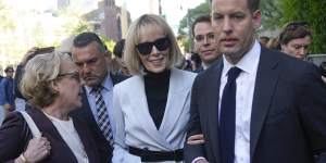 E. Jean Carroll (centre) leaves federal court in New York on Monday.