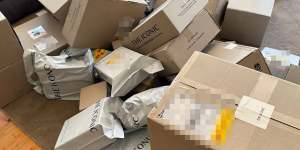 Boxes of clothing that scammers claimed on Telegram they had bought on other people’s accounts. 