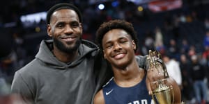 LeBron James,left,poses with his son Bronny.