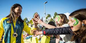 Green and gold was the theme at Melbourne Park,as basketballer Marianna Tolo greeted fans.