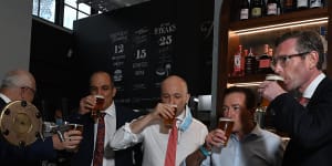 NSW Premier Dominic Perrottet enjoys a beer on Monday with Deputy Premier Paul Toole and Treasurer Matt Kean at Watson’s Pub in Moore Park.