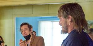 Trent Dalton,centre,on the set of Boy Swallows Universe with Travis Fimmel,right.