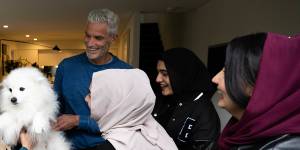 Craig Foster at home in Sydney with five young Afghan women who have become friends of the family. From left:Sahila,Frishta,Foster,Hosna,Lida and Madina.