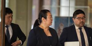 Jie Shao arrives at Downing Centre District Court on Thursday for her trial,accompanied by lawyers.