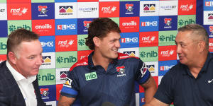 Knights coach Adam O’Brien,Kalyn and Andre Ponga at last year’s press conference announcing the star’s extension with the club.